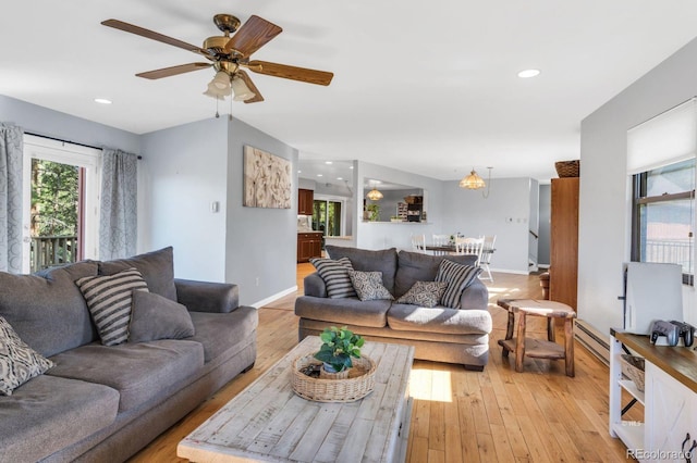 9591 State Highway 96, Westcliffe, CO 81252 - living area featuring a baseboard heating unit, a ceiling fan, light wood-style floors, and recessed lighting