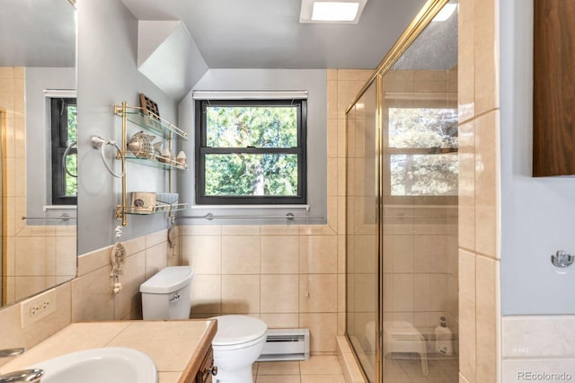 9591 State Highway 96, Westcliffe, CO 81252 - bathroom with tile walls, baseboard heating, tile patterned floors, vanity, and a shower stall