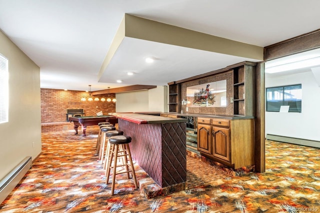 9591 State Highway 96, Westcliffe, CO 81252 - indoor dry bar featuring a baseboard heating unit, pendant lighting, and dark wood-type flooring