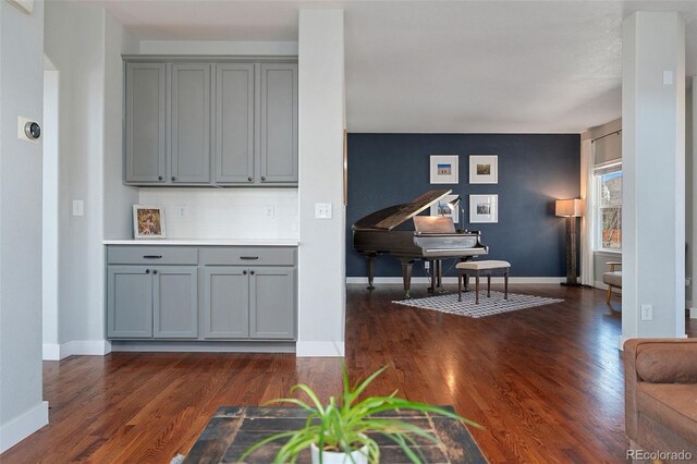 4464 E 139th Ave, Thornton, CO 80602 - living area featuring dark wood-type flooring and baseboards