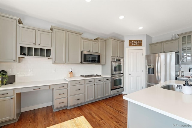 4464 E 139th Ave, Thornton, CO 80602 - kitchen with stainless steel appliances, gray cabinetry, tasteful backsplash, wood finished floors, and recessed lighting