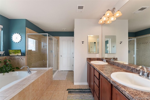 4464 E 139th Ave, Thornton, CO 80602 - full bathroom featuring a stall shower, double vanity, a garden tub, tile patterned flooring, and baseboards