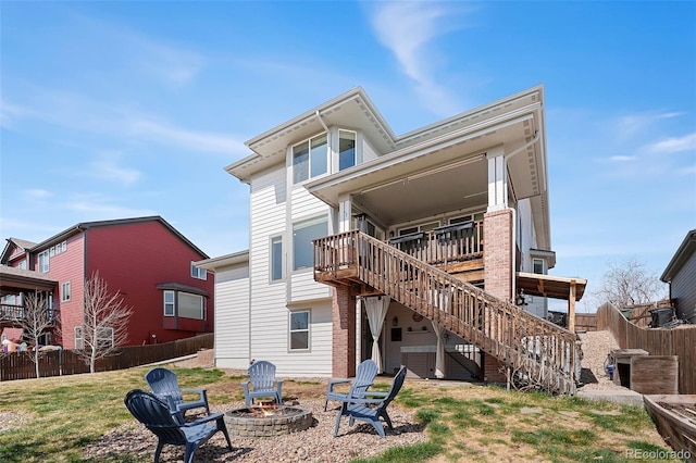 4464 E 139th Ave, Thornton, CO 80602 - rear view of house with an outdoor fire pit, stairway, and a deck