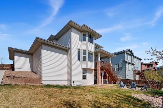 4464 E 139th Ave, Thornton, CO 80602 - back of property featuring stairway and an outdoor fire pit