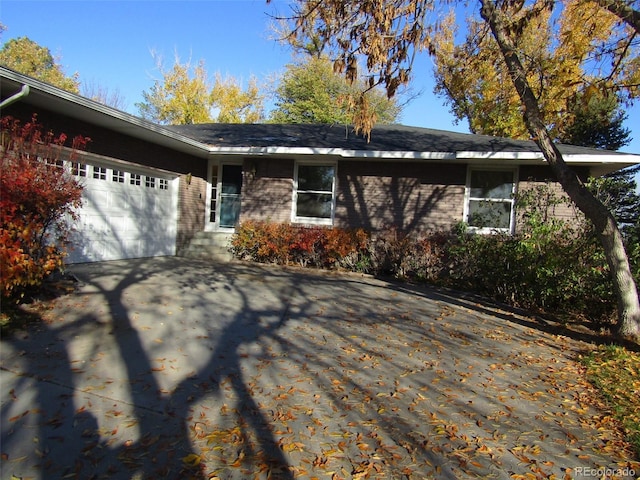 single story home featuring a garage