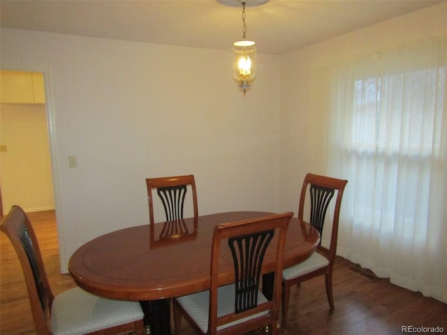 dining room with dark hardwood / wood-style floors