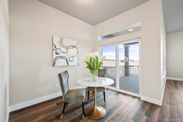 dining room featuring wood finished floors and baseboards