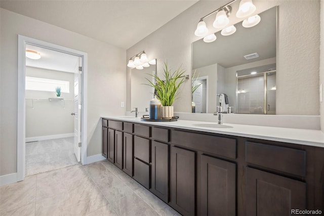 bathroom with double vanity, a sink, visible vents, and a shower stall