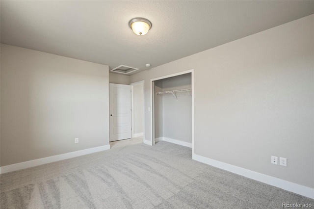 unfurnished bedroom with carpet flooring, visible vents, and baseboards