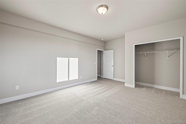 unfurnished bedroom featuring a closet, carpet flooring, and baseboards