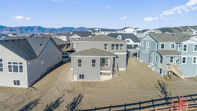 birds eye view of property featuring a residential view and a mountain view