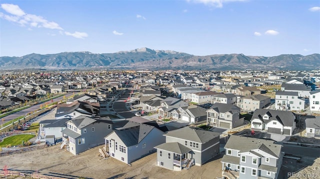 aerial view featuring a mountain view and a residential view