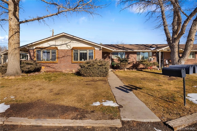 ranch-style home with a front yard