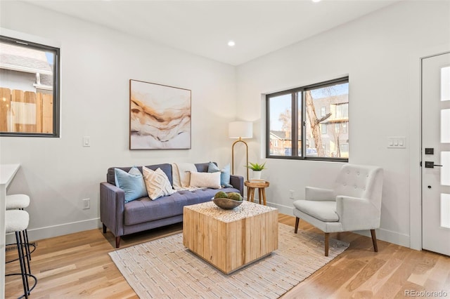 1715 Grove St, Denver, CO 80204 - living area with light wood-style flooring, baseboards, and recessed lighting