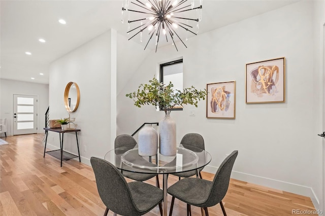 1715 Grove St, Denver, CO 80204 - dining area with light wood-style flooring, recessed lighting, baseboards, and a chandelier
