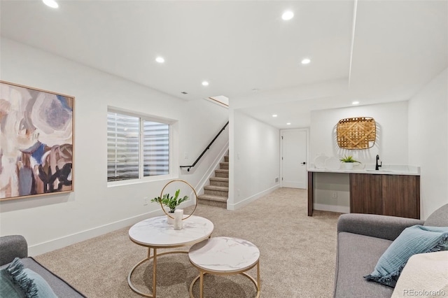 1715 Grove St, Denver, CO 80204 - living area with bar with sink, stairs, recessed lighting, light carpet, and baseboards