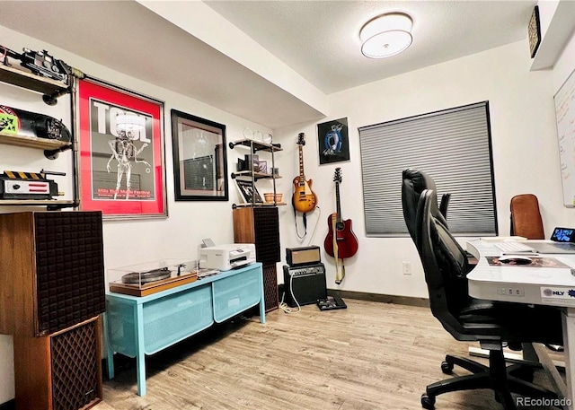 office with light hardwood / wood-style floors