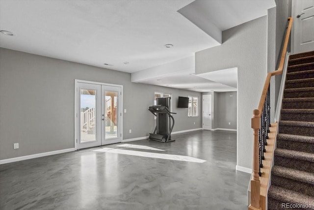 exercise area featuring french doors and a healthy amount of sunlight