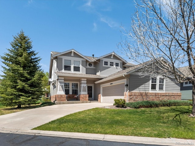 craftsman inspired home with brick siding, a front lawn, an attached garage, and driveway