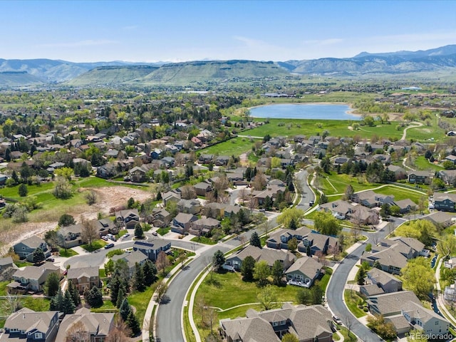 aerial view of residential area with a water and mountain view