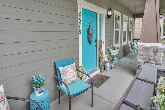 4578 Quandary Peak St, Brighton, CO 80601 - doorway to property featuring a porch