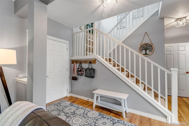 4578 Quandary Peak St, Brighton, CO 80601 - stairway with wood finished floors and baseboards