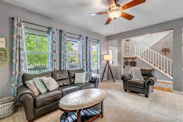 4578 Quandary Peak St, Brighton, CO 80601 - living area featuring stairs, baseboards, and a ceiling fan