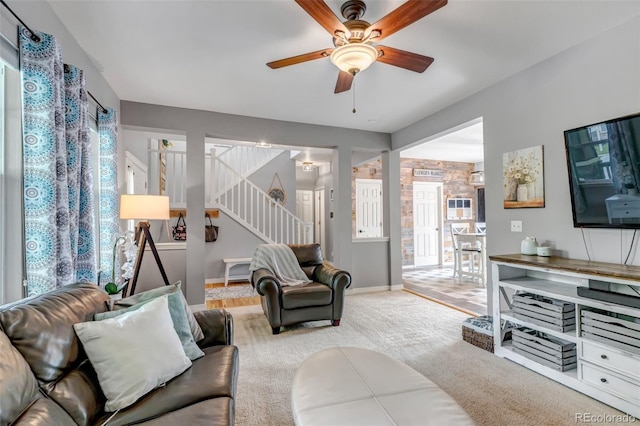 4578 Quandary Peak St, Brighton, CO 80601 - carpeted living room featuring stairway, ceiling fan, and baseboards