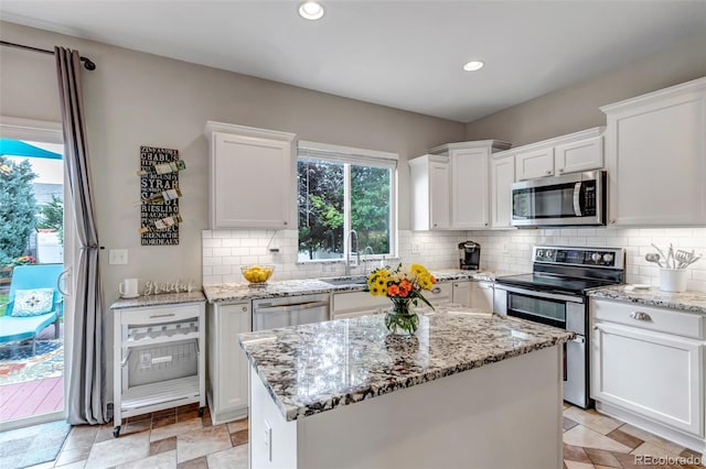 4578 Quandary Peak St, Brighton, CO 80601 - kitchen with appliances with stainless steel finishes, a sink, backsplash, and recessed lighting