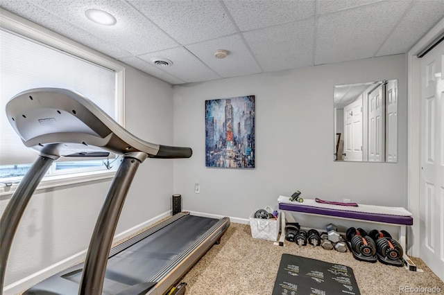 4578 Quandary Peak St, Brighton, CO 80601 - workout area featuring carpet floors, a paneled ceiling, and baseboards