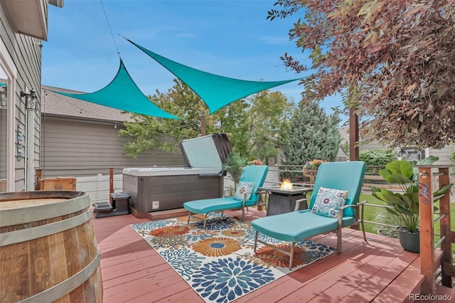 4578 Quandary Peak St, Brighton, CO 80601 - wooden terrace featuring a hot tub and a fire pit