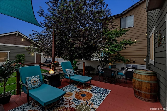 4578 Quandary Peak St, Brighton, CO 80601 - view of patio / terrace featuring a fire pit, grilling area, a wooden deck, and outdoor dining space