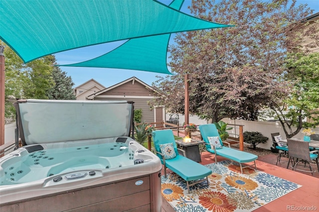 4578 Quandary Peak St, Brighton, CO 80601 - view of patio / terrace with a hot tub, a fire pit, and outdoor dining area