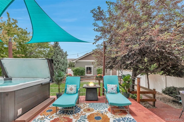 4578 Quandary Peak St, Brighton, CO 80601 - view of patio with a hot tub and a fire pit