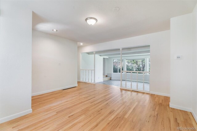8813 Baseline Rd, Lafayette, CO 80026 - spare room with wood finished floors, baseboards, and recessed lighting