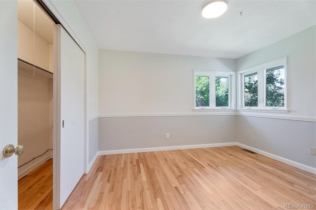 8813 Baseline Rd, Lafayette, CO 80026 - unfurnished bedroom featuring light wood-style floors, a closet, and baseboards