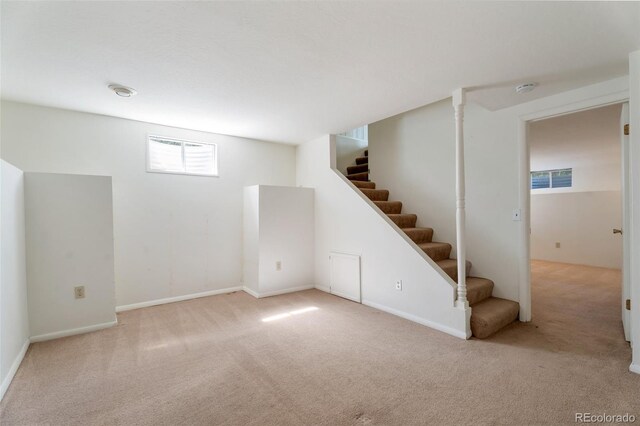 8813 Baseline Rd, Lafayette, CO 80026 - below grade area with carpet floors, stairs, and baseboards