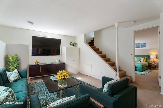 8813 Baseline Rd, Lafayette, CO 80026 - living room featuring light colored carpet and stairs