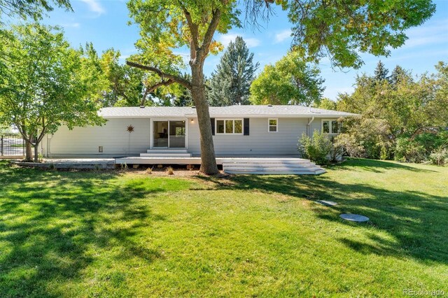8813 Baseline Rd, Lafayette, CO 80026 - back of property with a deck