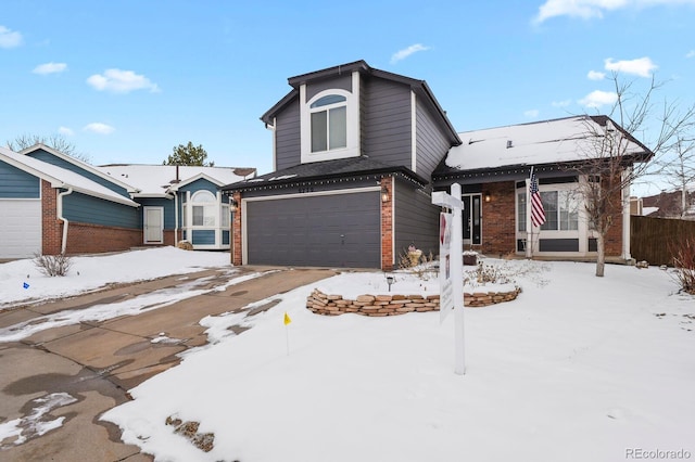 view of front of house with a garage and brick siding