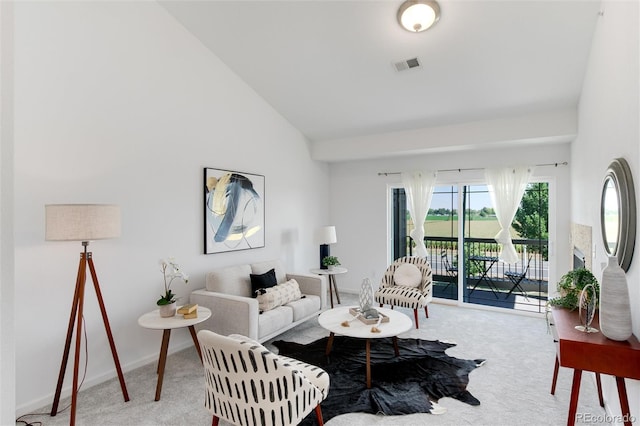 804 Summer Hawk Dr Unit 7301, Longmont, CO 80504 - carpeted living area featuring high vaulted ceiling and visible vents