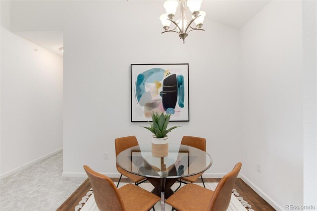 804 Summer Hawk Dr Unit 7301, Longmont, CO 80504 - dining room with a chandelier and baseboards