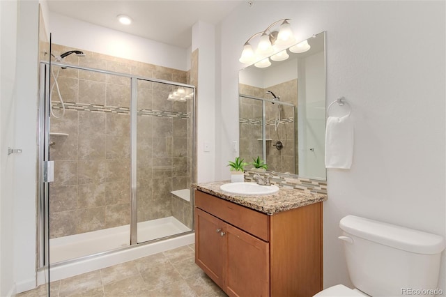 804 Summer Hawk Dr Unit 7301, Longmont, CO 80504 - bathroom with tile patterned flooring, toilet, vanity, and a stall shower