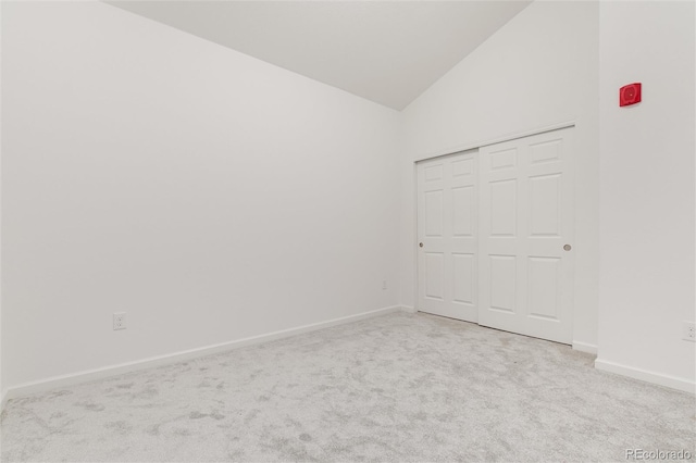 804 Summer Hawk Dr Unit 7301, Longmont, CO 80504 - unfurnished bedroom with high vaulted ceiling, carpet floors, a closet, and baseboards