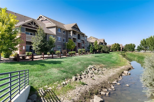 804 Summer Hawk Dr Unit 7301, Longmont, CO 80504 - view of home's community featuring a lawn and fence