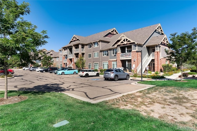 804 Summer Hawk Dr Unit 7301, Longmont, CO 80504 - view of property featuring uncovered parking