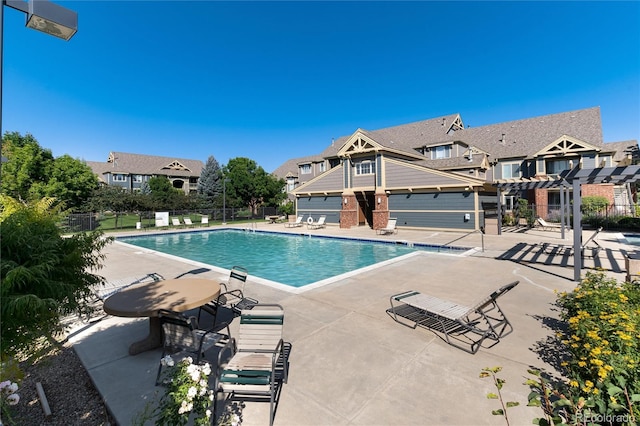 804 Summer Hawk Dr Unit 7301, Longmont, CO 80504 - pool featuring a pergola, a residential view, a patio, and fence