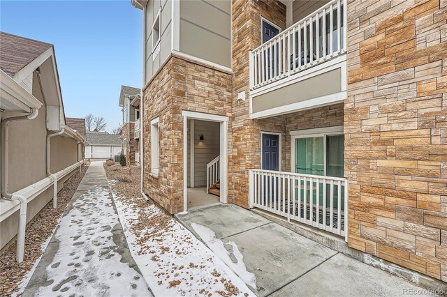 view of exterior entry with a garage