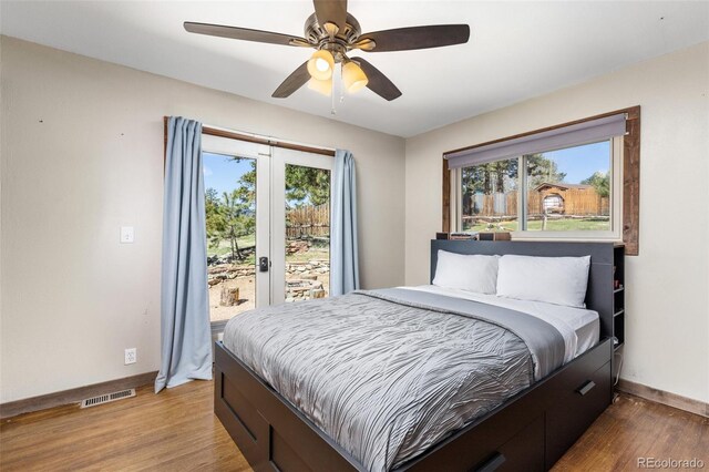 377 Homestead Rd, Bailey, CO 80421 - bedroom with access to exterior, wood finished floors, and ceiling fan