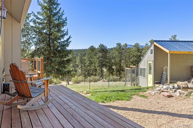377 Homestead Rd, Bailey, CO 80421 - wooden deck featuring a lawn and a forest view